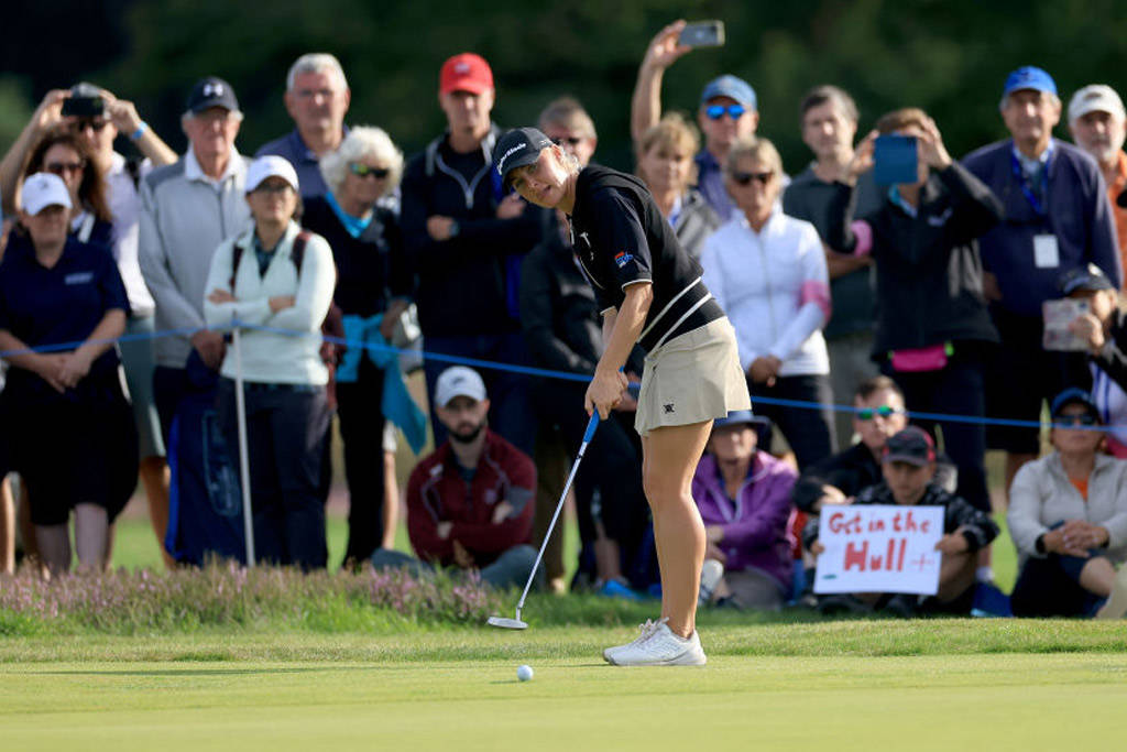 Spectators watch on as home favourite Charley Hull putts at Walton Heath during the AIG Women's Open in 2023